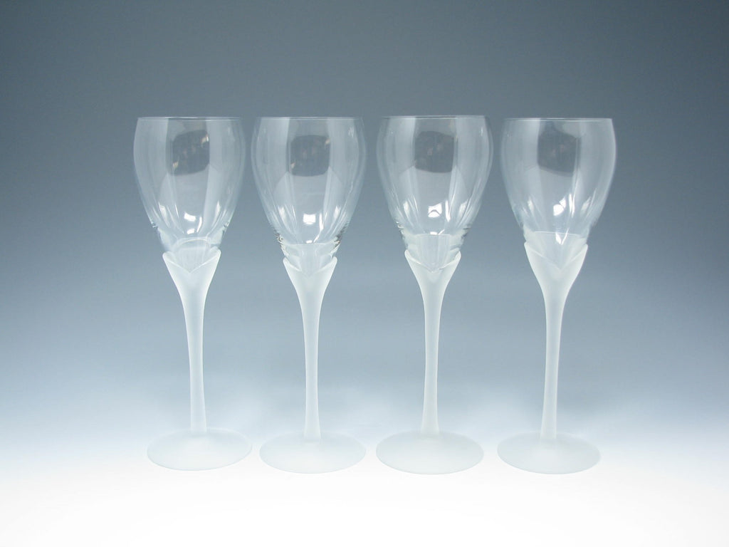 A Regency-style cut-glass ships decanter and four wine glasses